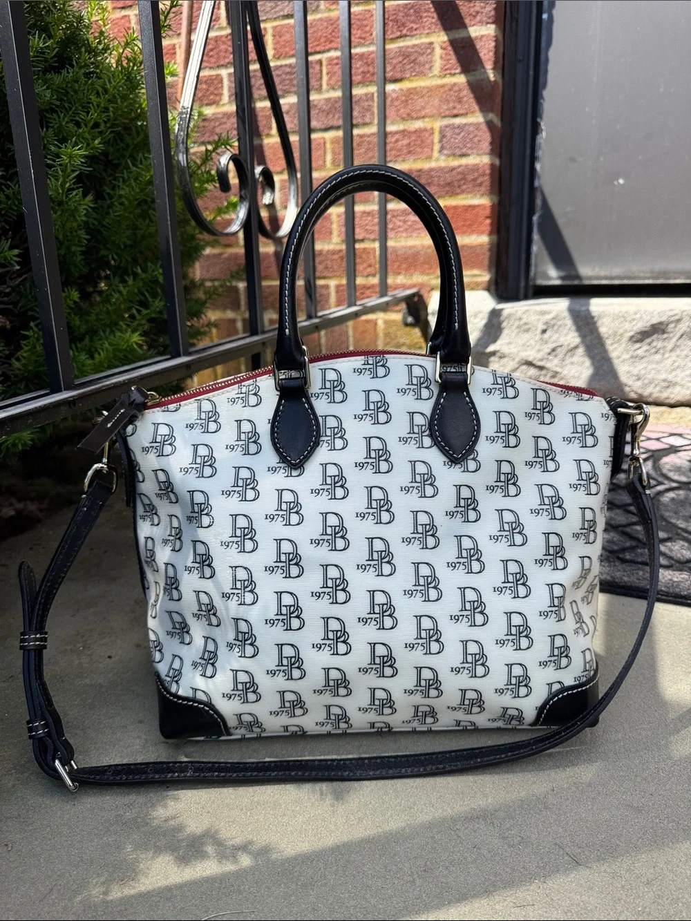 DOONEY AND BOURKE BLACK AND WHITE 1975 LOGO SATCHEL BAG